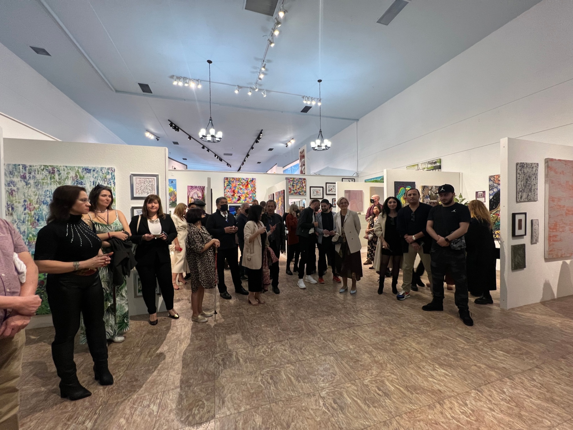 Crowd gathered in the ART 2 art District's grand exhibition hall.